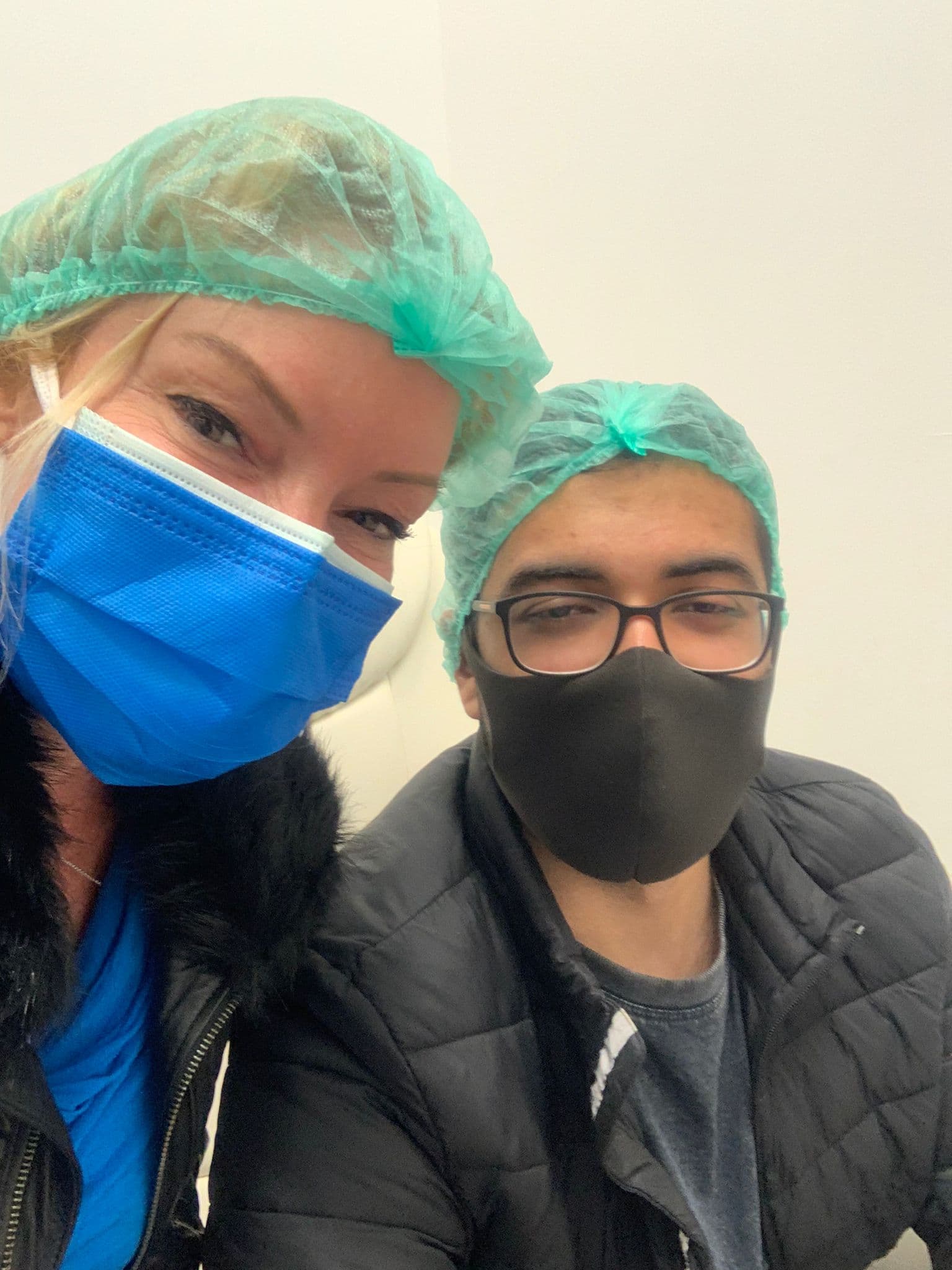 Medical assistant supporting a patient